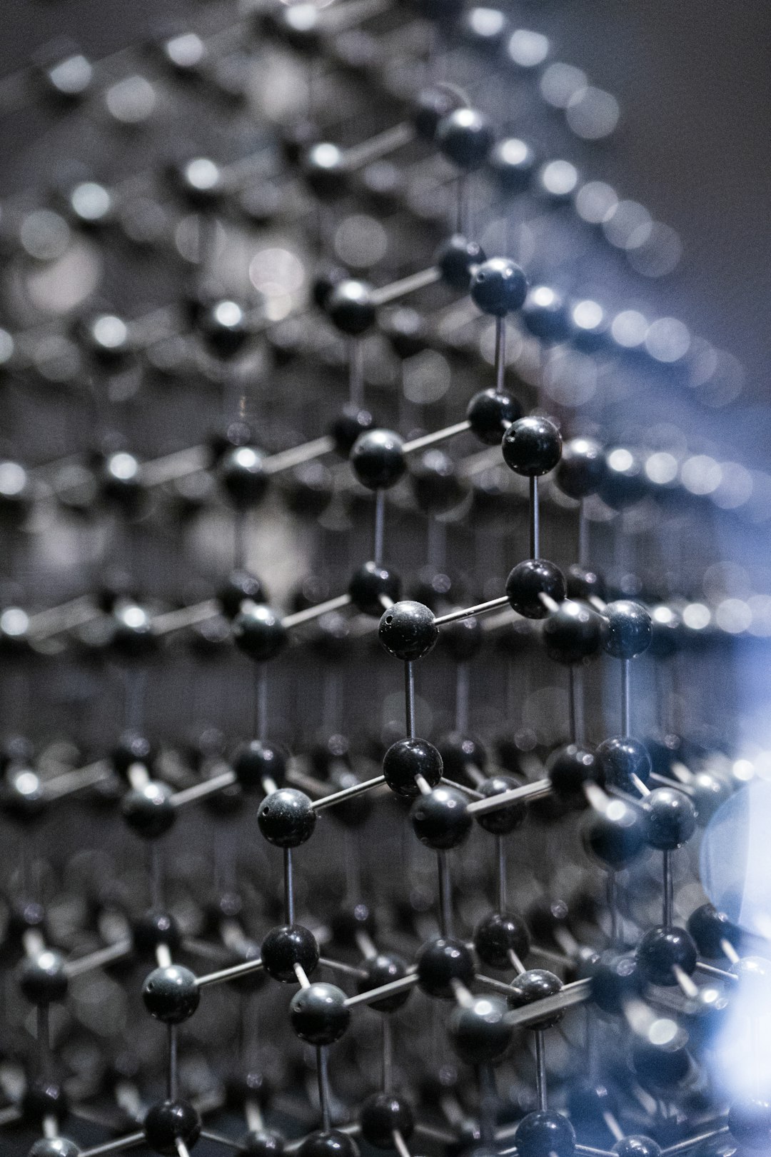 a-close-up-of-a-metal-structure-with-many-balls-tahdummfjm4